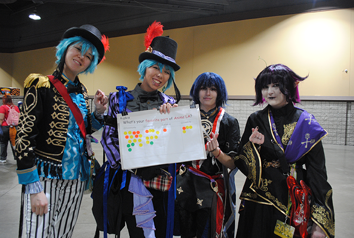 Cosplayers holding our b.glen survey board